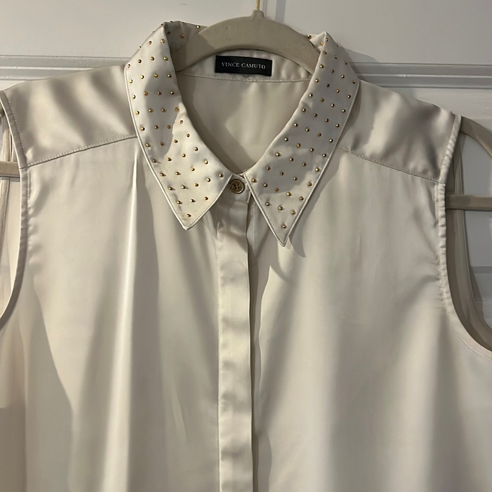 Sleeveless collared white button down with gold studded collar